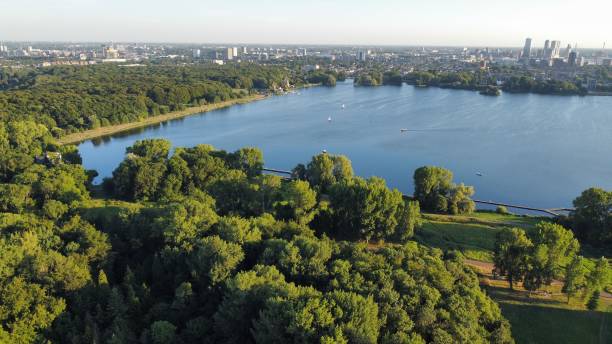 istock Beautiful river surrounded by green trees 1417674589
