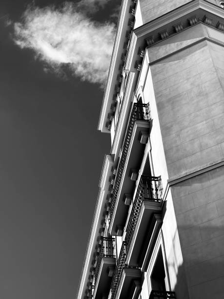 istock Vertical low-angle grayscale of a building with balconies 1417675572
