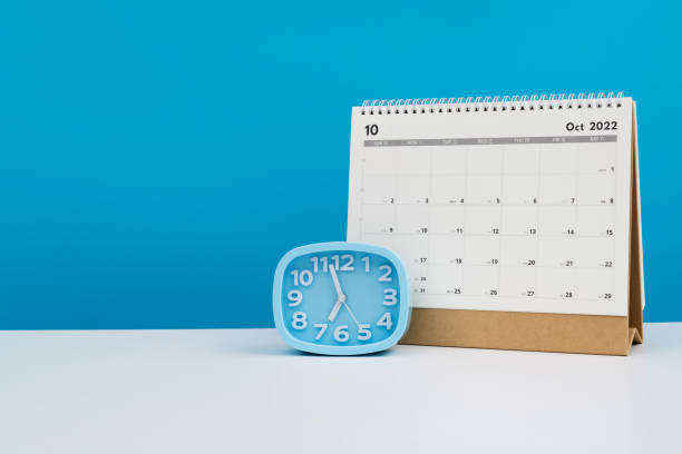 istock Calendar and alarm clock on the table 1417675923