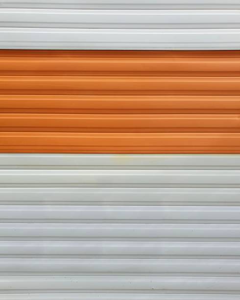 istock orange and white colour corrugated metal with horizontal lines 1417678511