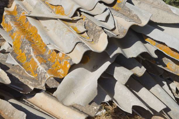 istock Broken Asbestos Cement Sheets with Asbestos Waste fly tipping Group of broken and fibrous slice 1417679895