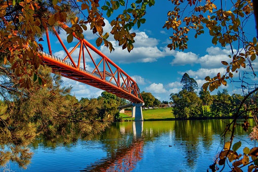 A low-angle view of Yandhai Nepean Crossing bridge above river in Australia