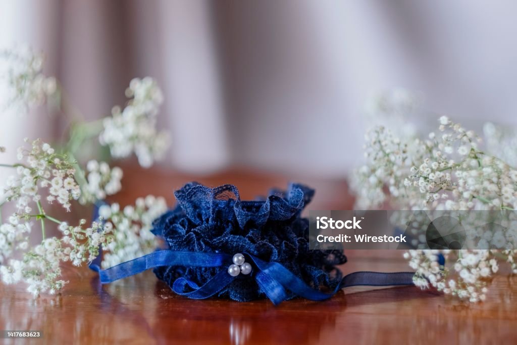 Closeup shot of a blue wedding bridal wrist corsage on a table A closeup shot of a blue wedding bridal wrist corsage on a table Beauty Stock Photo
