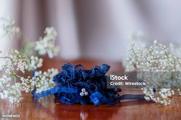 Closeup Shot Of A Blue Wedding Bridal Wrist Corsage On A Table Stock Photo - Download Image Now