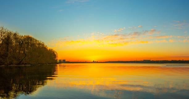 istock Aerial view of sea surrounded by trees during sunset 1417687792