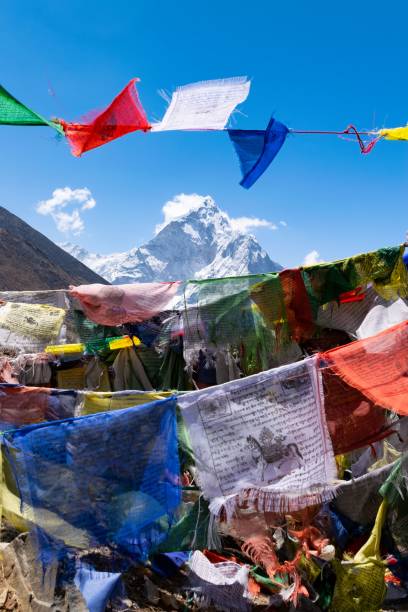 istock Kangtega mountain peak seen through colorful clothes hanging on a rope 1417687956