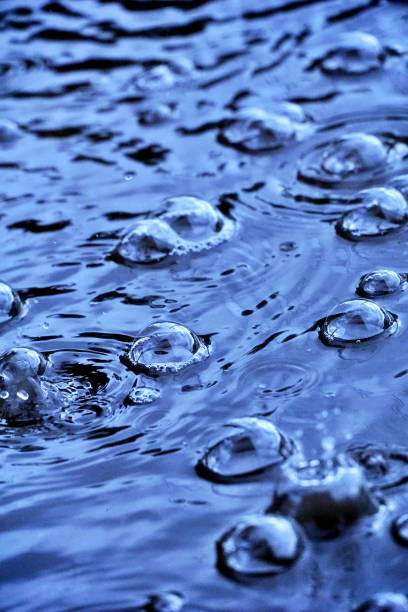 istock Air bubbles on the surface of the pathway when it rain. 1417689497