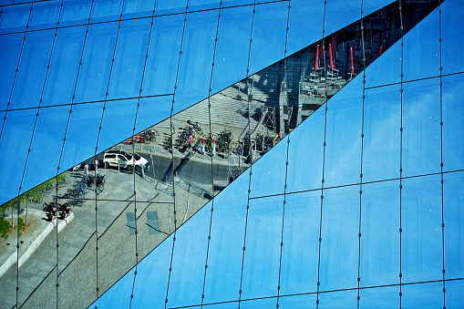 Glass Office building facade with Distorted reflections, central Berlin, Germany