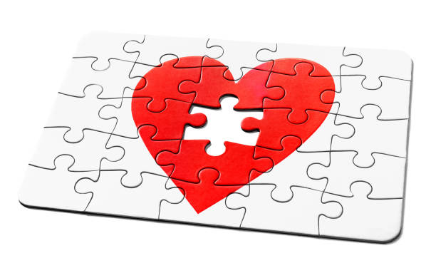 Jigsaw puzzle of a red romantic heart, with one missing piece, representing a problem to be solved