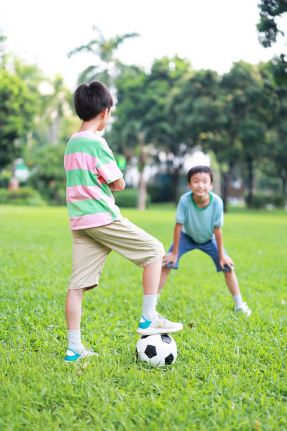 istock Boy with soccer ball 1417691631