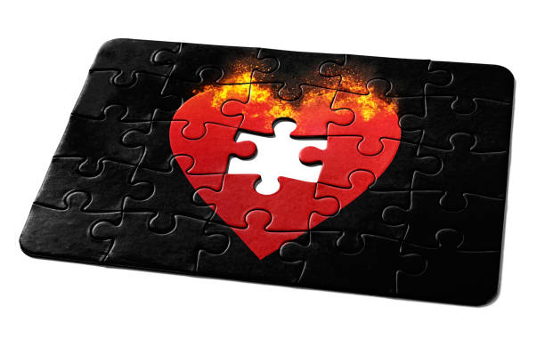 istock Jigsaw puzzle of a burning red heart, with one missing piece, representing a romantic problem to be solved 1417691989