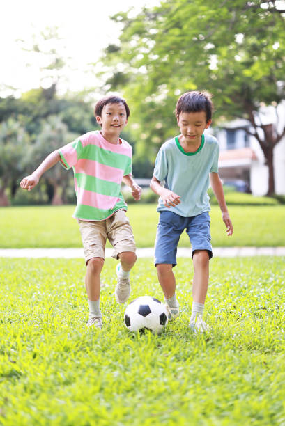 istock Boy with soccer ball 1417692351