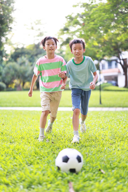 istock Boy with soccer ball 1417692364