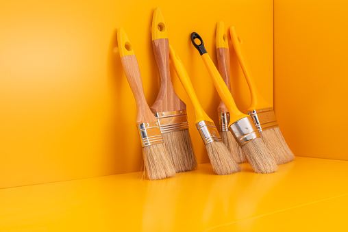 Set of paint brushes with yellow space