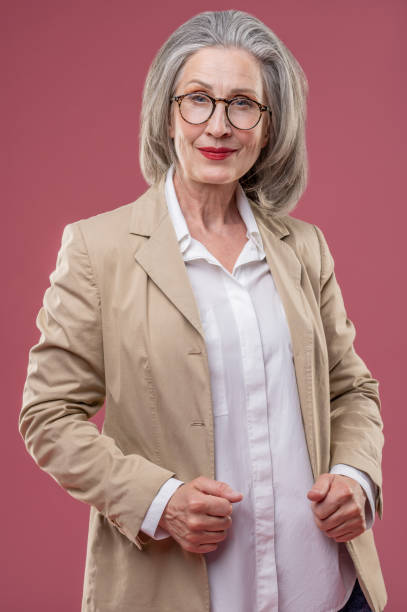 istock Effective mature woman in beige jacket 1417695096