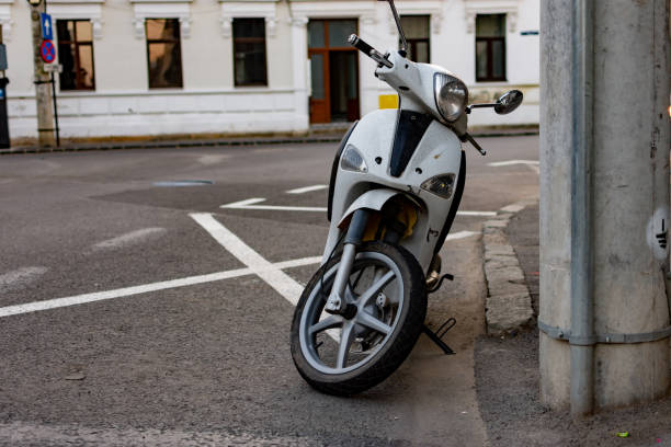 istock White scooter parked in town 1417695282
