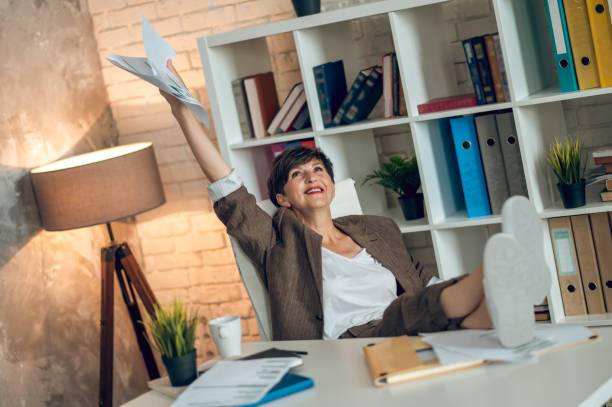 istock Business owner sitting at the table and looking relaxed 1417695423