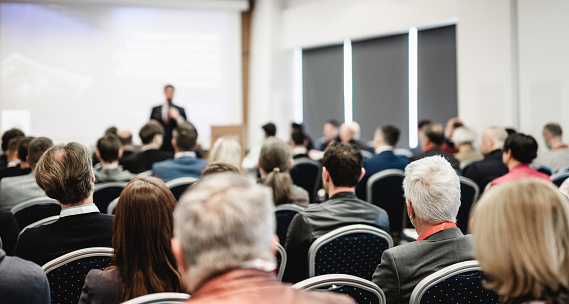 Woman giving speaker presentation