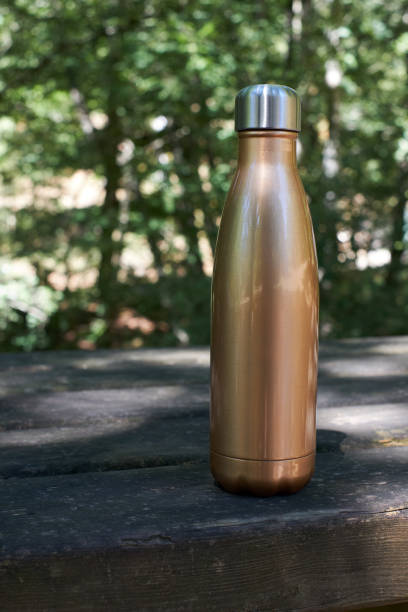 istock Sustainable thermos bottle on natural background. 1417699934
