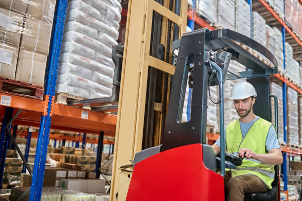 istock Experienced storehouse loader operating the electric forklift 1417700523