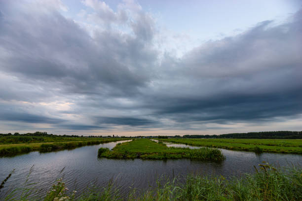 Scenic view of dramatic looking clouds over the Dutch polder landscape near Gouda, Holland.