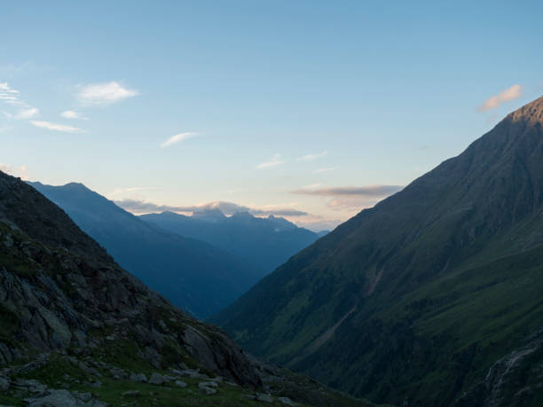 istock Evening view from Nurnberger Hutte mountain hut at valley with sharp mountain peaks at Stubai hiking trail, Stubai Hohenweg, Summer rocky alpine landscape of Tyrol, Stubai Alps, Austria 1417715738