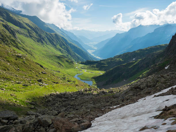 istock Beutiful green summer alpine mountain valley with winding river spring stream. Stubai hiking trail, Stubai Hohenweg at Tyrol, Austrian Alps 1417716720