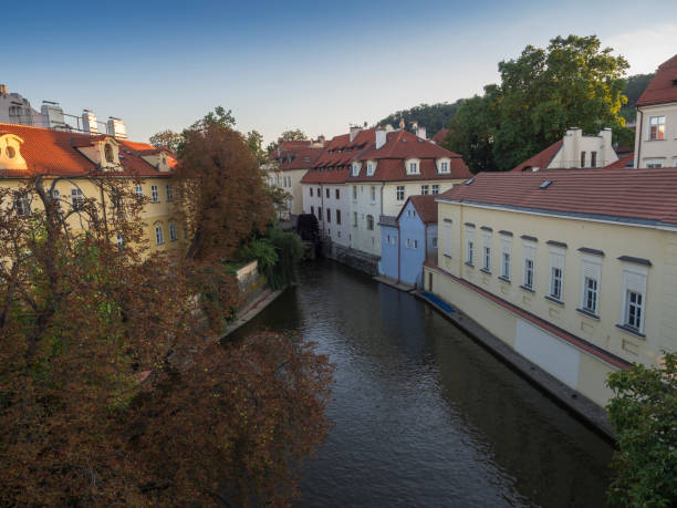 istock Certovka river, Devil's Channel, also called Little Prague Venice between Kampa island and Mala strana in Czech Republic Prague with Historic wooden Mill Wheel, autumn sunny day 1417716952