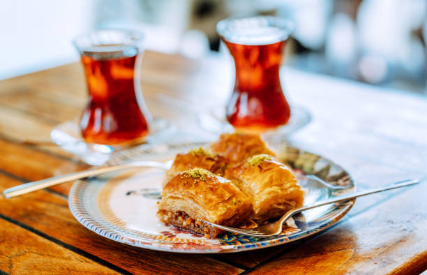 istock Delicious Turkish baklava and tea on a wooden table top 1417719032