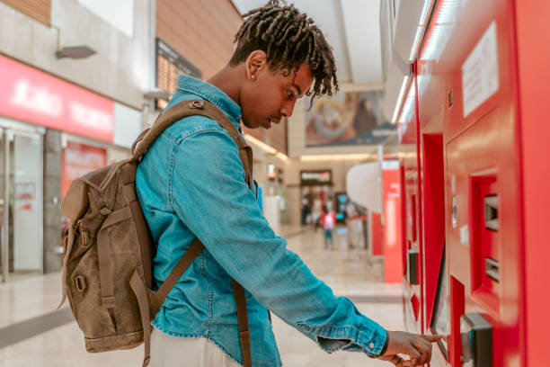 istock Guy standing sideways to camera near self-service terminal 1417721462