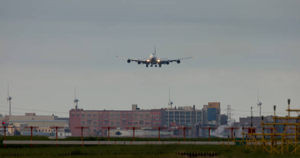 istock Airplane Landing at Dusk 1417721512