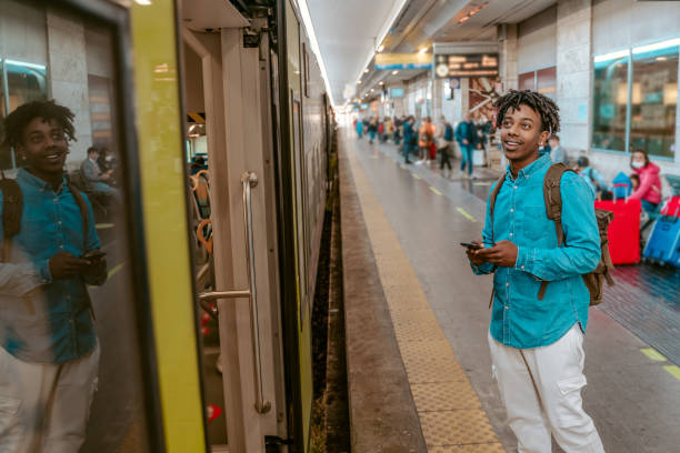 istock Guy looking at open door of train car 1417721538