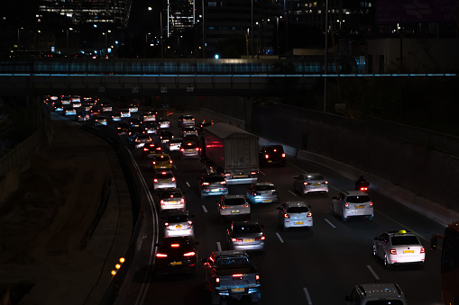 Car traffic at night city on highway road.