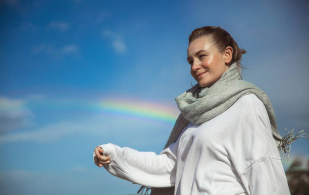 istock Happy Woman and Rainbow 1417730776