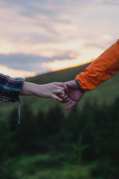 istock couple man and woman holding hands 1417732640