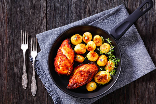 istock grilled chicken breasts with browned new potatoes 1417734329