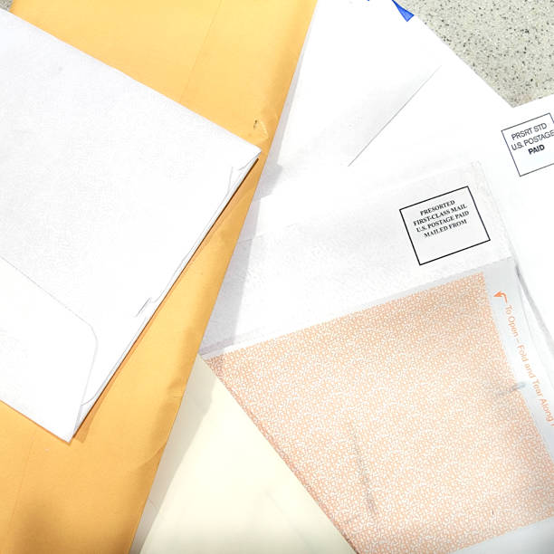 istock LV Finances - table scattered with mail that includes bills, personal correspondence and junk mail. 1417735082