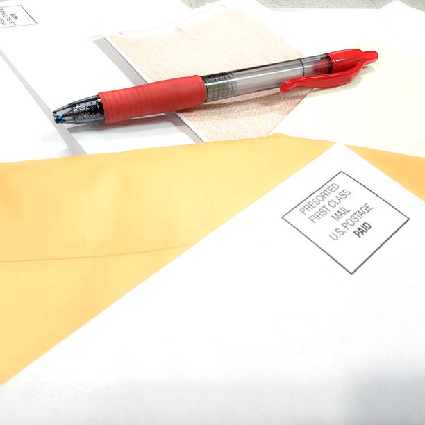 istock LV Finances - table scattered with mail that includes bills, personal correspondence and junk mail. 1417735088