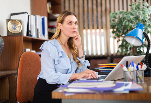 istock Successful business woman using laptop at workplace 1417739535