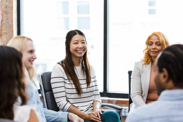 istock Diverse co-workers participate in employee engagement meeting 1417742179