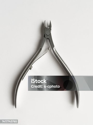 istock Manicure and pedicure scissors on the white background 1417743765