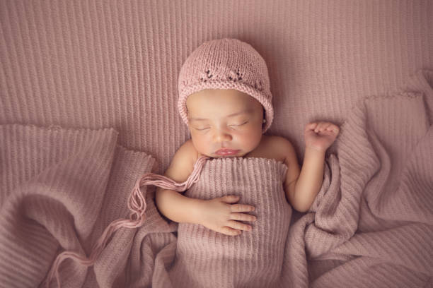 istock Newborn baby girl sleeping 1417745790
