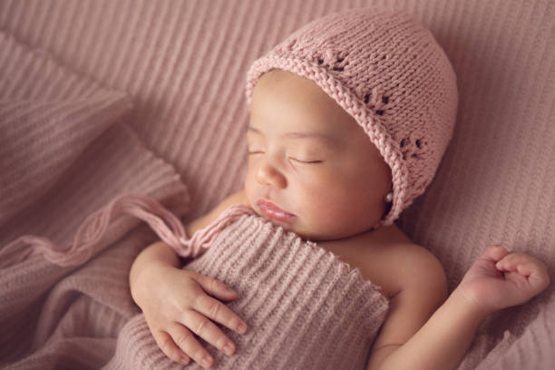 istock Newborn baby girl sleeping 1417745805