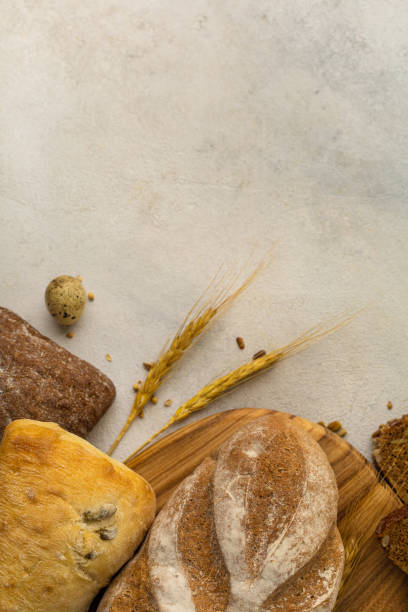 istock Various types of bread: rye, gluten-free, wheat, multi-cereal, on a light background 1417746896