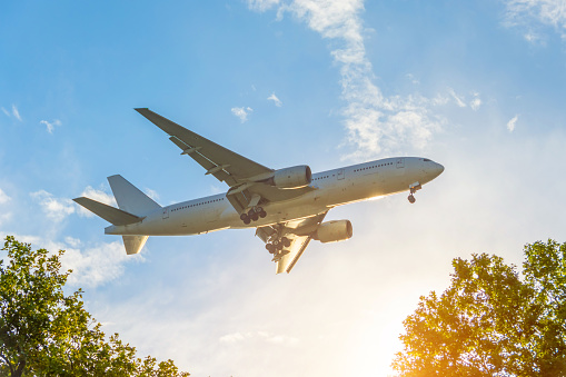 Passenger airplane landing at dusk