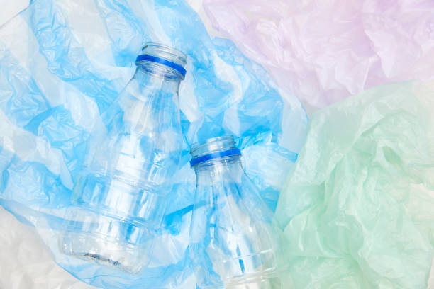 istock Plastic disposable bottles over single use plastic bags. Recycle, sustainability 1417748437