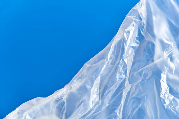 istock Plastic bag on blue background. Creative design about plastic pollution, recycle 1417748527
