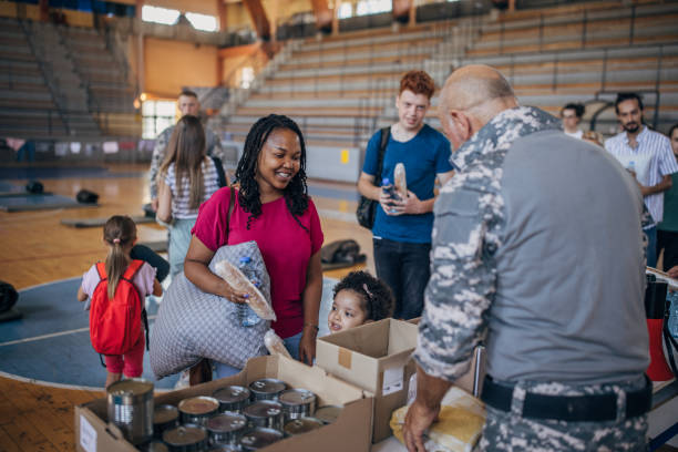 istock Civilians receiving donations after natural disaster 1417749645