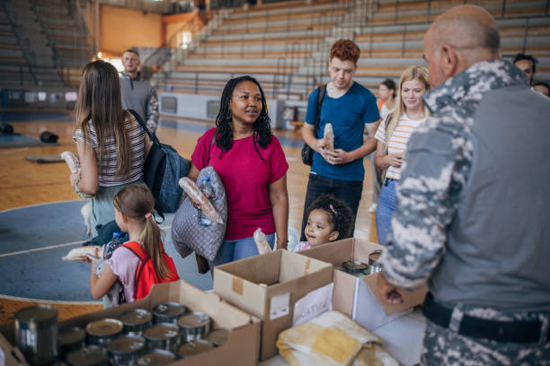 istock Civilians receiving donations after natural disaster 1417749665