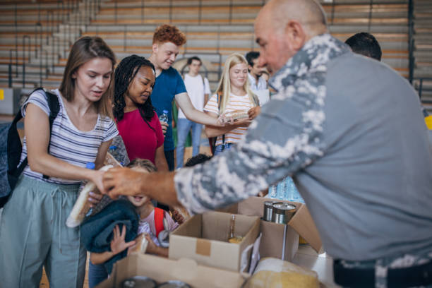 istock Moms with kids receiving donations after natural disaster 1417749714